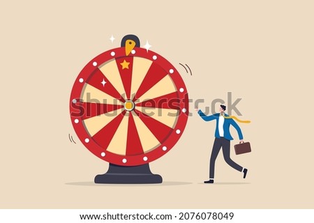 Life depend on luck, fortune wheel randomness, chance and opportunity to get new job, investment winning or gambling concept, excite businessman looking at spinning fortune wheel waiting for luck.