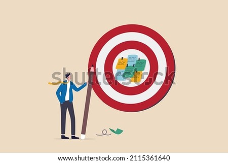 Goal setting, achievable target or purposeful objective, mission to accomplish or challenge to win for business success concept, businessman write down goal on notes and put on big dartboard target. 商業照片 © 
