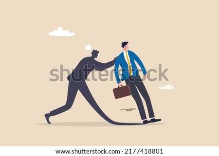 Courage entrepreneur, pushing yourself to success, encourage self believe, determination or aspiration to overcome challenge concept, fearful businessman being push by his shadow self to success.