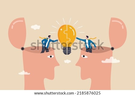 Understanding lead to success, agreement or think together to find solution to solve problem, insight or team communication concept, businessmen partner open their head to connect lightbulb jigsaw. 商業照片 © 