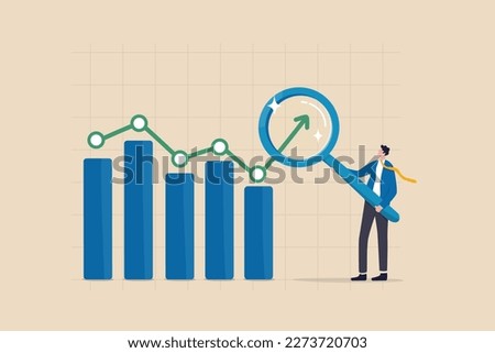 Trend analysis, marketing and sales information, analyze or predict trend line or profit, business forecast report concept, businessman analyst analyze trend graph and chart with magnifying glass.