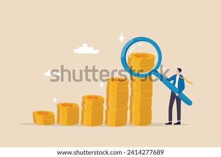 Investment or financial analysis, wealth management or revenue growth, economic or profit improvement, income or portfolio analysis concept, businessman with magnifying glass on growth coin stack.