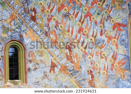 Moldavian style of exterior paintings wall at Sucevita Monastery in Sucevita village,Bucovina, Romania.