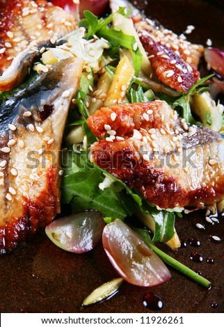 Japan food with fish and sesame closeup background