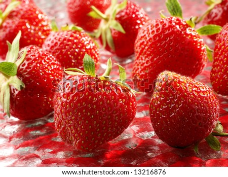 Fresh strawberry fruit group on red background