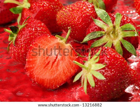 Fresh strawberry fruit group on red background