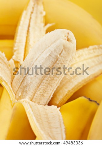Fresh open banana fruit on yellow background