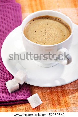 Coffee hot drink with sugar cube