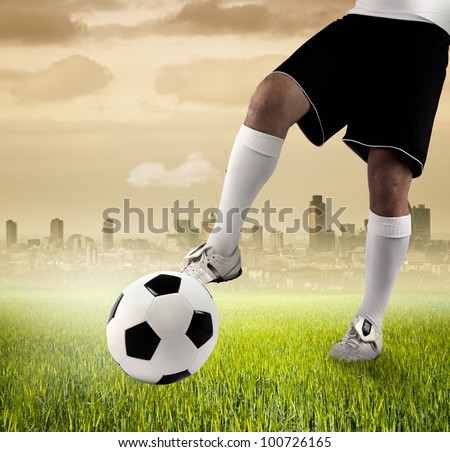 Football player in a green field