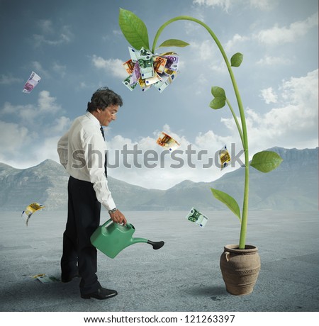 Businessman and a plant of money