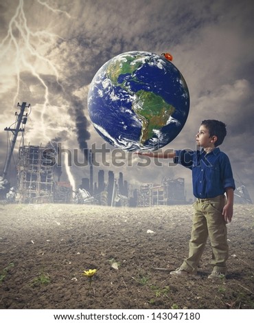 Young boy holds the word. Concept of save the world