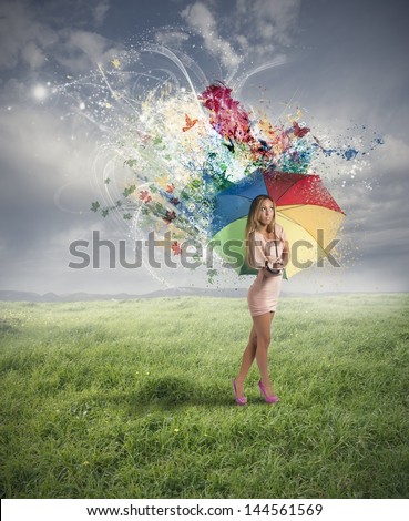 Creative fashion girl with colorful umbrella
