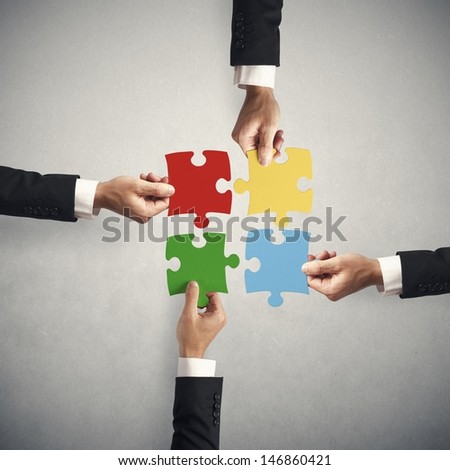 Teamwork and partnership concept with puzzle