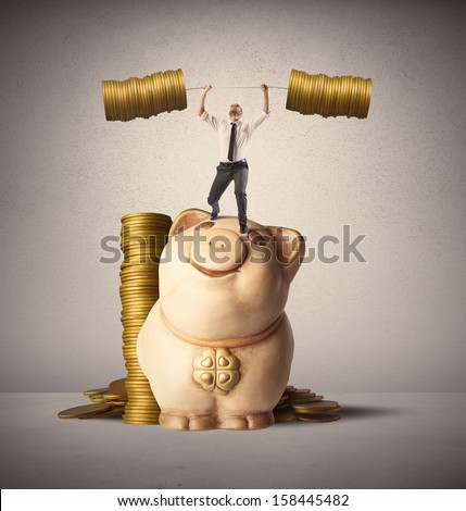 Concept of earning of a businessman who raises money as weights