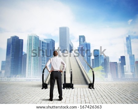 Businessman in front of a stairs to success