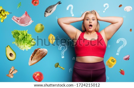 Fat girl in fitness suite wants to start a diet but has doubts about the food to buy. Cyan background
