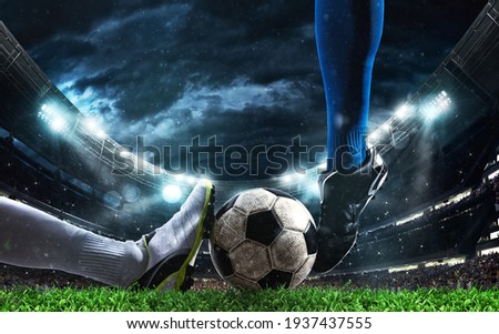 Close up of a football action scene with competing soccer players at the stadium Photo stock © 