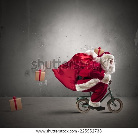 Fast Santa Claus on a small bike