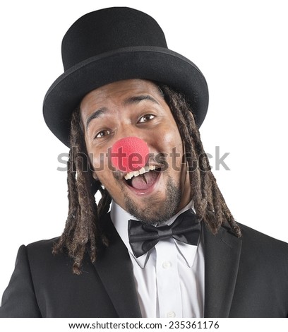 Elegant clown smiles with his red nose