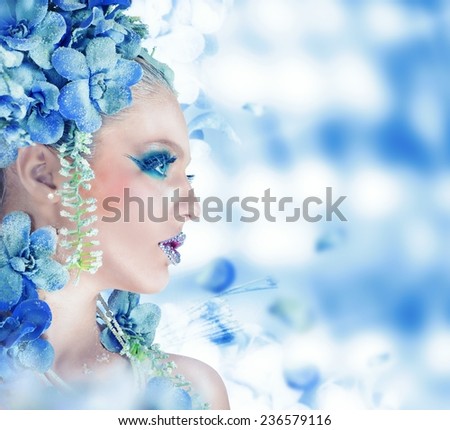 Winter flowers fairy with blue sparkling makeup