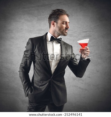 Businessman in elegant dinner drinking his cocktail