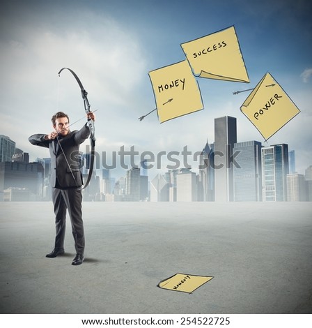 Businessman pointing and hits his work goals