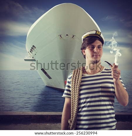 Sailor relaxes and smokes front of ship