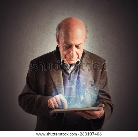 Senior uses tablet to surf the internet