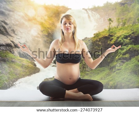 Pregnant relaxes and keeps fit doing yoga