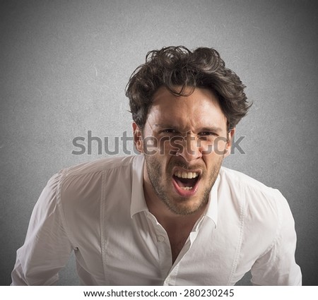 Angry businessman stressed out from work screams
