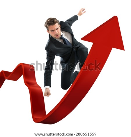 Determined businessman over a big red arrow