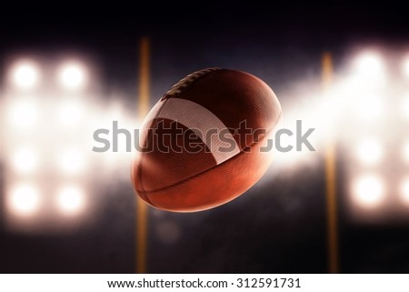 Football ball flying fast through the air