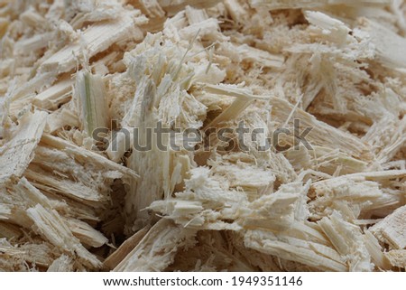 Dried bagasse is piled together. Sugarcane are completely squeezed out of nectar, leaving only residues and fibers. Sugarcane waste is waste from production and can be recycled into other products. Stockfoto © 