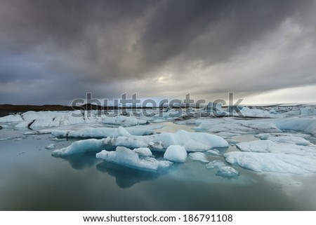 Icebergs in Jokulsarlon glacier lake at sunset/Icebergs