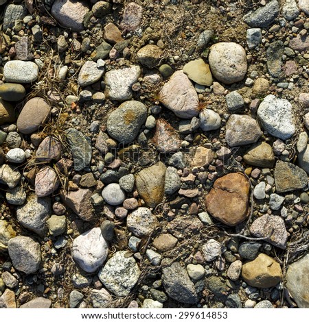 Stones On Ground Surface Texture Background/ Stones And Ground