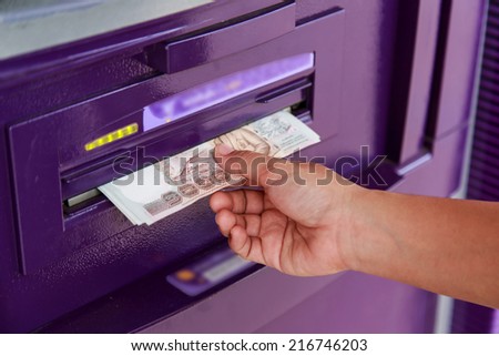 Close up of hand take money from ATM/bank machine