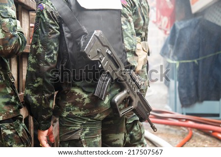Thai Soldier with gun at the back side