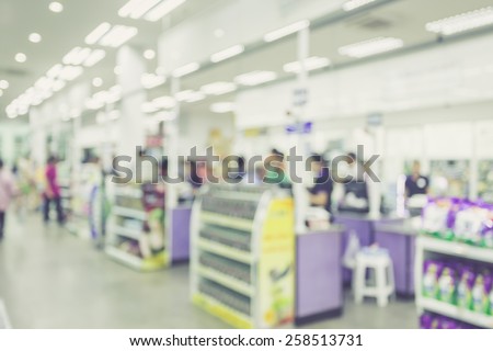 Supermarket store blur background ,Cashier counter with customer, vintage filter effect