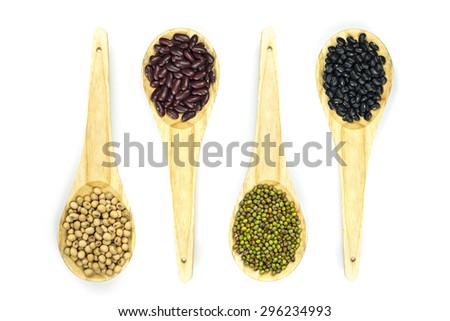 Set of several natural grain in wooden spoon on white background
