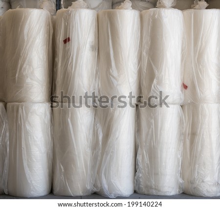 Packaging supplies with bubble wrap. Packed rolls in white plastic.