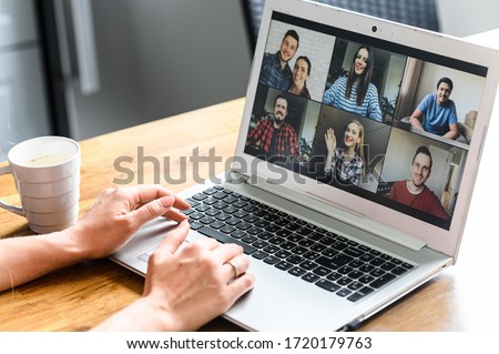 Video call. Icons of a group of people on laptop screen, app for video online communication. Female hands on the keyboard