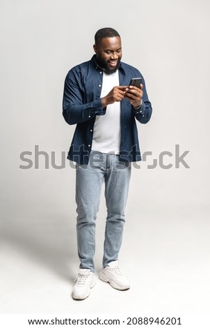 Similar – Image, Stock Photo Black man using smartphone on street