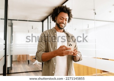 Similar – Image, Stock Photo Smiling entrepreneur using smartphone outside office building