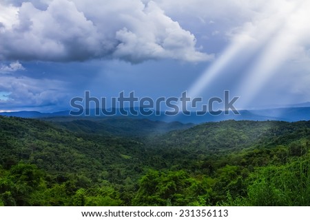 Majestic mountains landscape under morning sky with clouds. Overcast sky before storm.