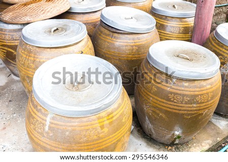 Thai water jar in the countryside house used for storage rain water.