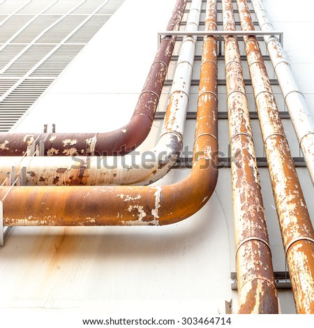 Rusted water pipe over the building