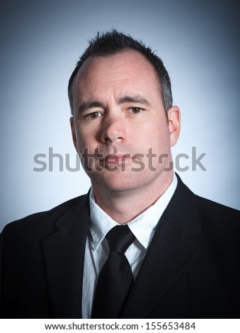 Caucasian businessman 40 years old isolated on a grey background