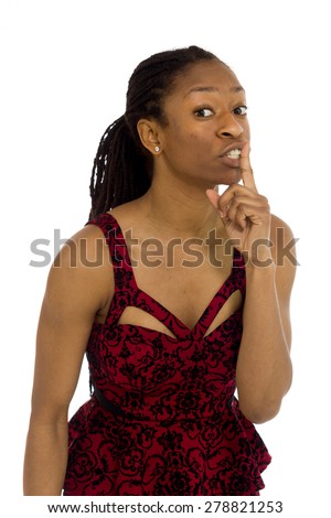 Model isolated on plain background in studio fingers on lips with secret