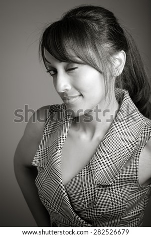 Indian business woman posing in studio isolated on a background, black and white image