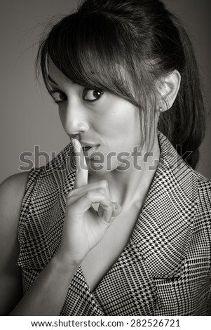 Indian business woman posing in studio isolated on a background, black and white image